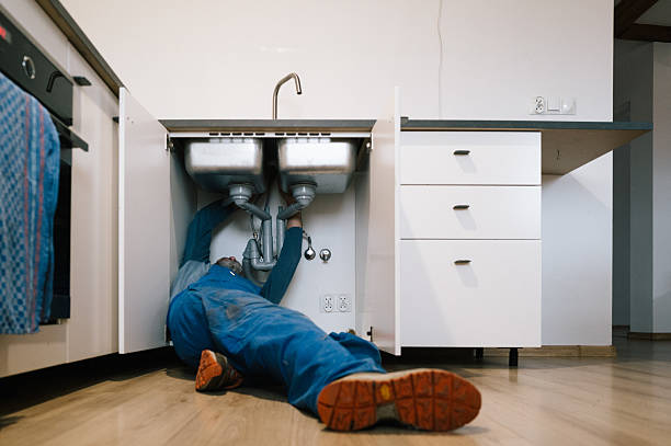 Professional Emergency Plumber technician working in Otterbein, IN